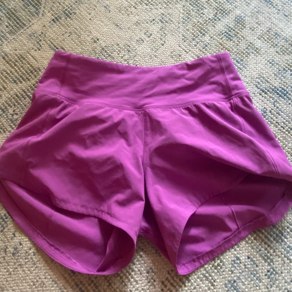 Lulu lemon size 2 speed ups 4 inch. Color a purple. Barely worn. No damage